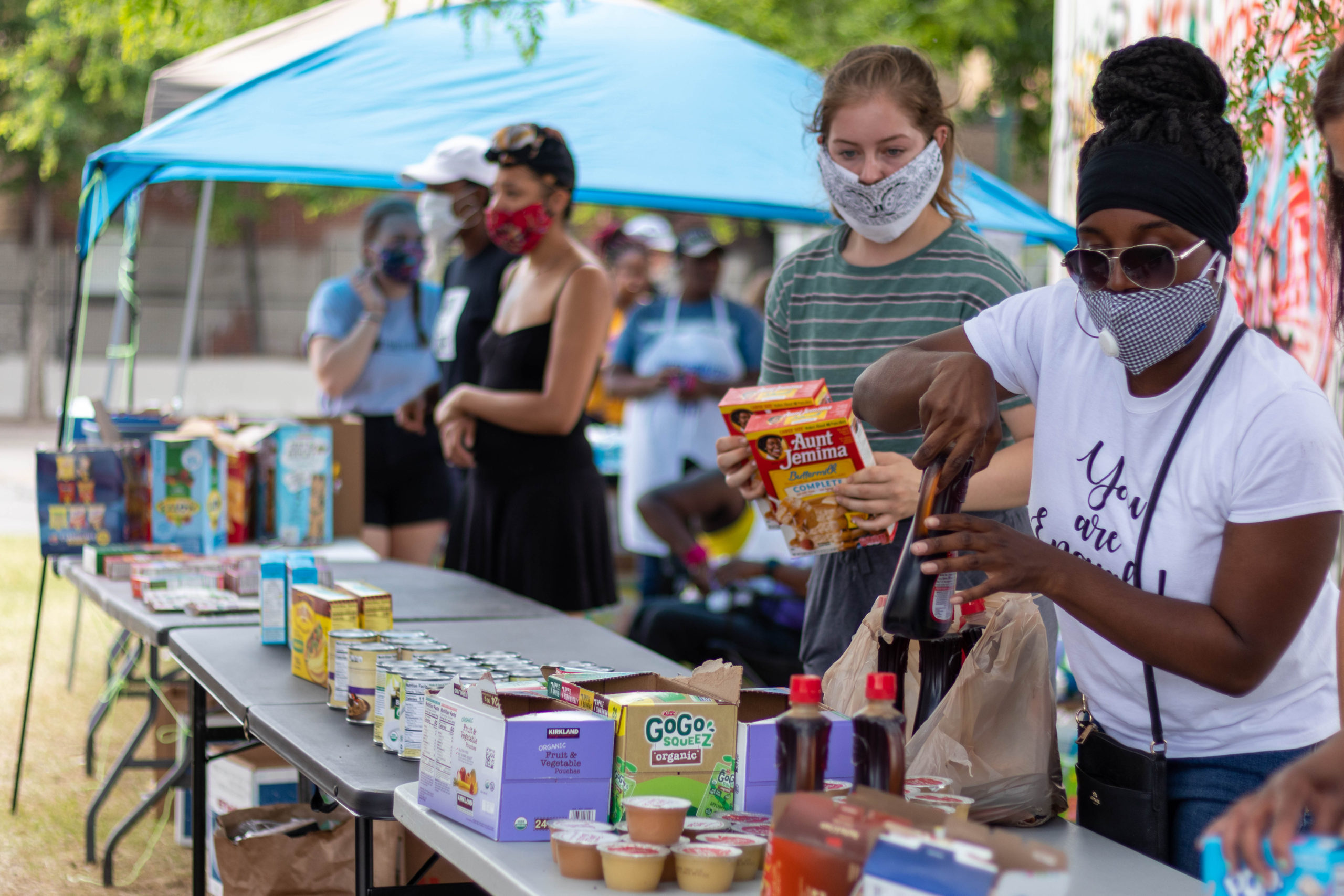 Community mutual aid — volunteers distributing food